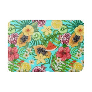 Tropical mix-fruit, flowers and leaves on blue bath mat