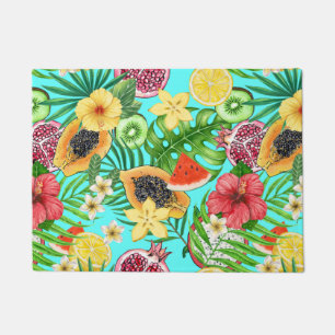 Tropical mix-fruit, flowers and leaves on blue doormat