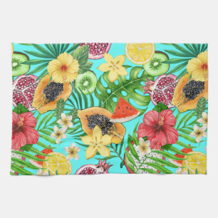 Tropical mix-fruit, flowers and leaves on blue kitchen towel