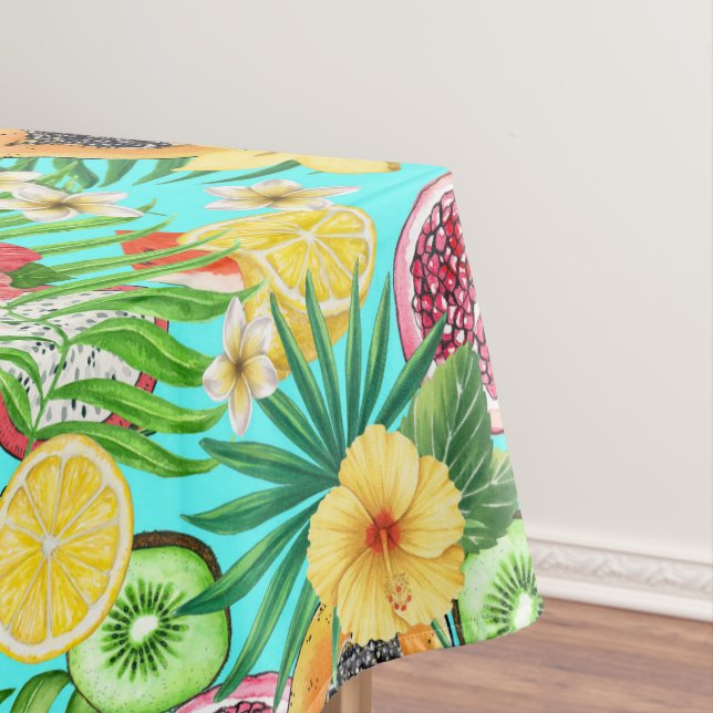 Tropical mix-fruit, flowers and leaves on blue tablecloth (In Situ)