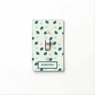 Tropical monstera leaves monogram on blue light switch cover