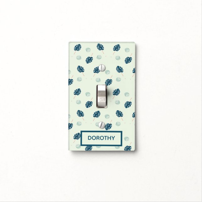 Tropical monstera leaves monogram on blue light switch cover (In Situ)