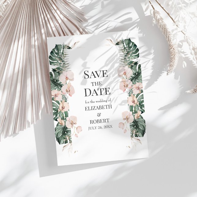 Tropical Orchid and Monstera Save the Date Invitation (Tropical Orchid and Monstera Save the Date Invitation on a sunny white table.)