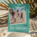 Tropical Palm Tree Mele Kalikimaka Photo Holiday Card<br><div class="desc">Bring the warm Hawaiian vibes to your loved ones this holiday season! Our modern Hawaiian Christmas card is an expression of love, featuring a delightful teal background, a square slot for a family photo, striking dark teal palm trees, and adorned with the heartening 'Mele Kalikimaka' greeting. Personalize it further with...</div>