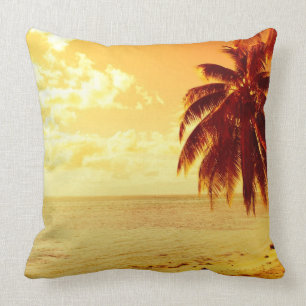 Tropical palm trees at a beach at sunset pillow