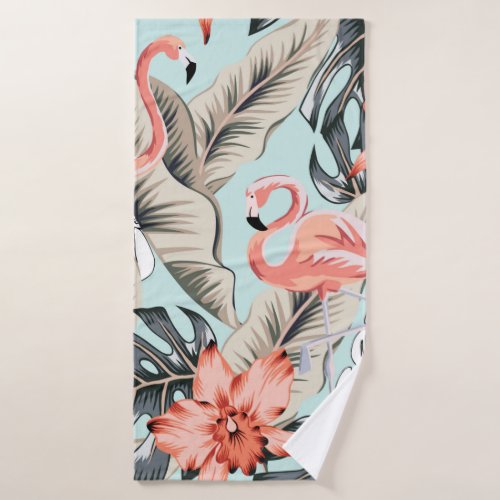 Tropical pink flamingo with orchid flowers and lea bath towel