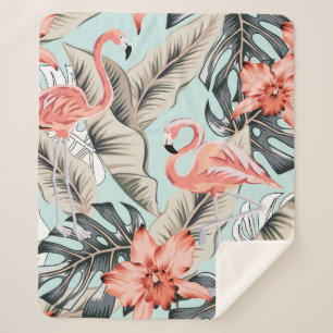 Tropical pink flamingo with orchid flowers and lea sherpa blanket