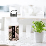 Tropical Pink & Gold Palm Leaves Pattern & Name   Stainless Steel Water Bottle<br><div class="desc">The Tropical Pink & Gold Palm Leaves pattern features a vibrant and exotic design inspired by tropical aesthetics. The color scheme revolves around shades of pink and gold, creating a luxurious and stylish look. The pattern consists of palm leaves rendered in a variety of sizes and orientations, evoking a sense...</div>
