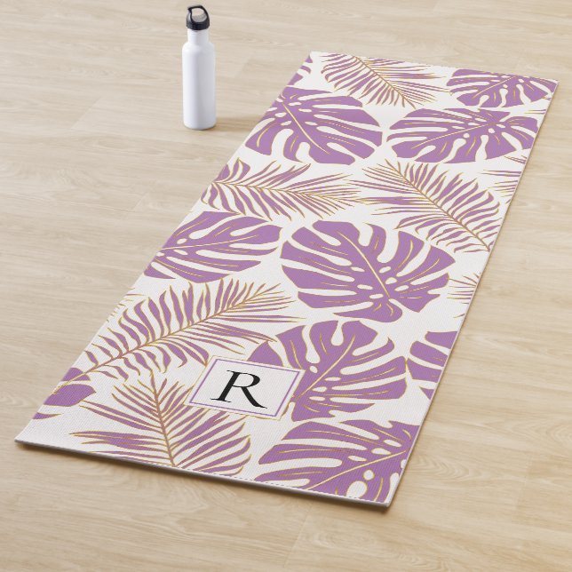 Tropical purple and gold leaves and monogram yoga mat (In Situ)