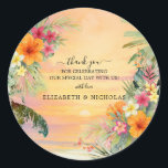 Tropical Sunset Thank You Wedding Sticker<br><div class="desc">Add the perfect finishing touch to your event with this Tropical Sunset Thank You Sticker, featuring a warm watercolor sunset, lush palm leaves, and hand-painted tropical florals in soft orange, pink, and yellow tones. Ideal for sealing envelopes, favor bags, or welcome gifts, this round sticker brings a cohesive look to...</div>
