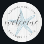 Tropical Vintage Beach Starfish Wedding Welcome Classic Round Sticker<br><div class="desc">Round "welcome" stickers with a muted blue vintage starfish illustration and rustic light gray wood background with personalized names and wedding date is perfect for customizing welcome bags and wedding favors for a beach destination wedding.</div>