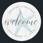Tropical Vintage Beach Starfish Wedding Welcome Classic Round Sticker<br><div class="desc">Round "welcome" stickers with a muted blue vintage starfish illustration and rustic light gray wood background with personalized names and wedding date is perfect for customizing welcome bags and wedding favors for a beach destination wedding.</div>