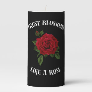 Trust blossoms like a rose pillar candle