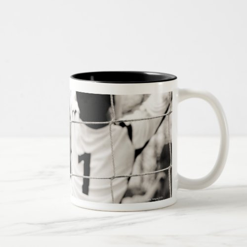 Trying to protect the team with the net in focus Two_Tone coffee mug
