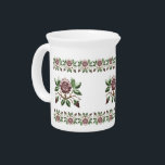 Tudor Roses Beverage Pitcher<br><div class="desc">Part of the perfect tea set, this lovely milk jug features the familiar rose of the Tudors, complete with little gold crown. Three large roses are bordered top and bottom with rows of several smaller ones.</div>