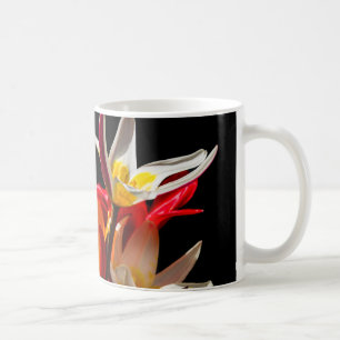 Tulip flowers against black background coffee mug