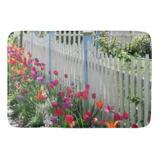 Tulips along white picket fence bath mat