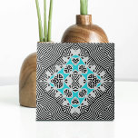 Turquoise Black White Geometric Dynamic Lines  Ceramic Tile<br><div class="desc">This ceramic tile showcases a captivating blend of modern and timeless aesthetics. The background features a dynamic pattern reminiscent of zebra stripes, with alternating black and white lines of varying thicknesses. This creates a visually striking backdrop for the symmetrical geometric pattern at the center of the tile. The central pattern...</div>