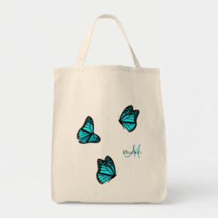 turquoise butterflies flitting on a breeze tote bag