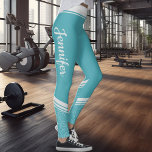 Turquoise floral white stripes & name modern leggings<br><div class="desc">These turquoise modern workout leggings feature an elegant white floral design on the ankles and calves and white stripes on the waistband.
Easily customizable by adding your name on both sides on a calligraphy white font.</div>