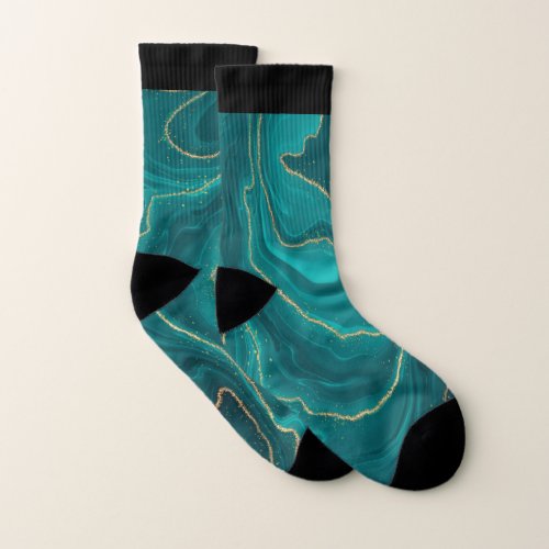 Turquoise liquid marble background with gold socks