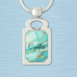 Turquoise Marble, Gold Accent Print, Rectangle Keychain<br><div class="desc">Shades of turquoise marble with gold accent background and a black script name, decorate this 1.8" long 1.1" wide rectangle silver-colored metal keychain. Change name using the simple Template provided. Available shapes: twisted heart, swirl, oval and rectangle (shown). The background and text are printed in full color on a metal...</div>