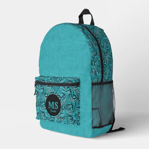 Turquoise monogram tooled leather western style printed backpack