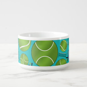 Turquoise tennis balls rackets and nets bowl