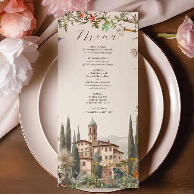 An Italian-themed wedding menu featuring artwork of Tuscany. The menu is lying on a plate and other flowers can be seen on the table.