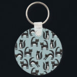 Tuxedo Black and White Cats Keychain<br><div class="desc">Cute black and white tuxedo cats going about their business. A fun pattern on a mid blue background.</div>