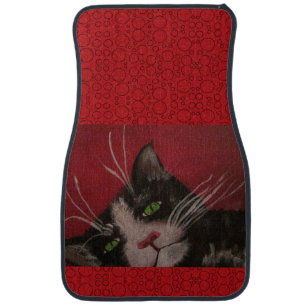 tuxedo cat on red car mat