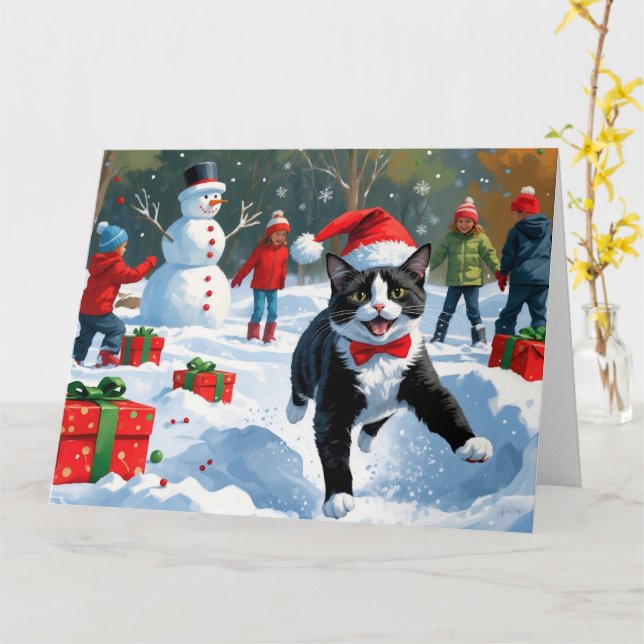 Tuxedo Cat Running in Snow with Christmas Hat Card (Yellow Flower)