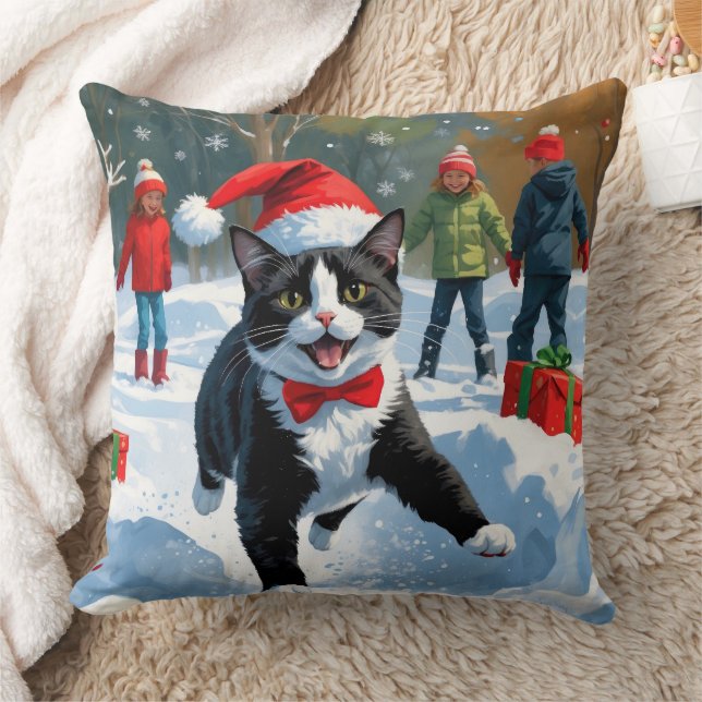 Tuxedo Cat Running in Snow with Christmas Hat Throw Pillow (Blanket)
