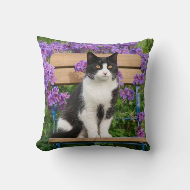 Tuxedo cat sitting on a garden chair with flowers throw pillow (Front)