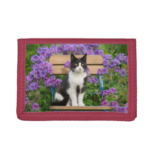 Tuxedo cat sitting on a garden chair with flowers trifold wallet