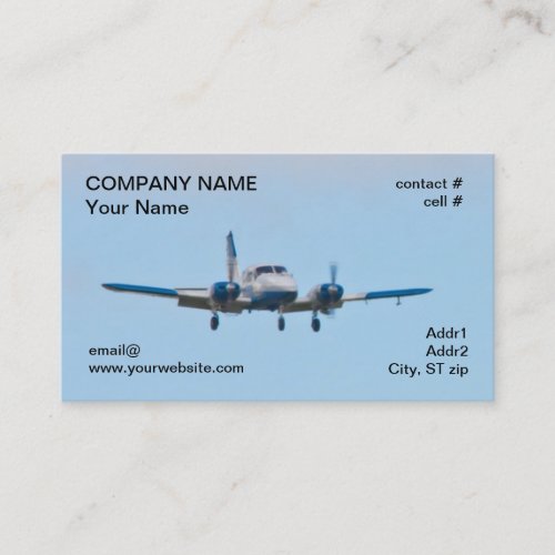 Twin airplane on landing approach business card