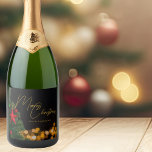 Twinkling Gold Lights Modern Merry Christmas Party Sparkling Wine Label<br><div class="desc">This gorgeous Merry Christmas champagne bottle label features modern gold handwritten script over twinkling lights next to a festive Christmas tree that is decorated with red and green ornaments. Customize these elegant holiday sparkling wine labels for your friends and family with personalized script over the black night sky.</div>