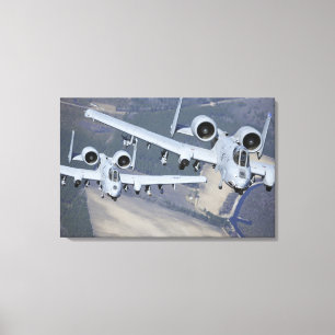 Two A-10C Thunderbolt II aircraft fly in format Canvas Print