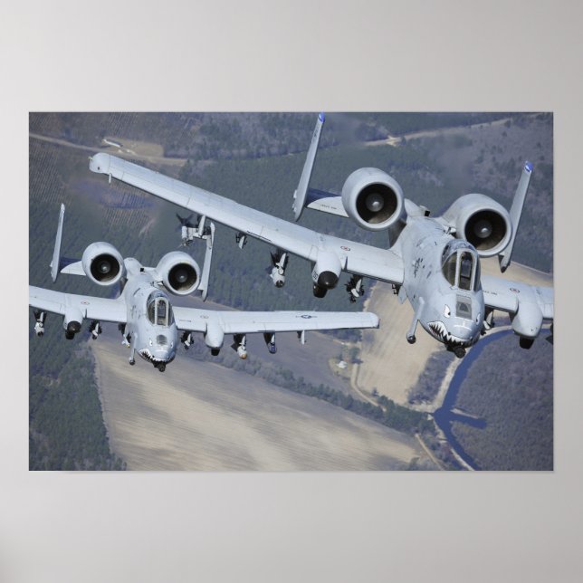Two A-10C Thunderbolt II aircraft fly in format Poster (Front)
