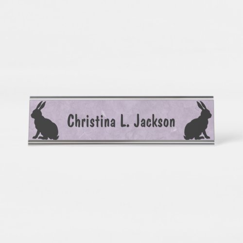 Two Black Sitting Rabbits in Silhouette on Purple Desk Name Plate