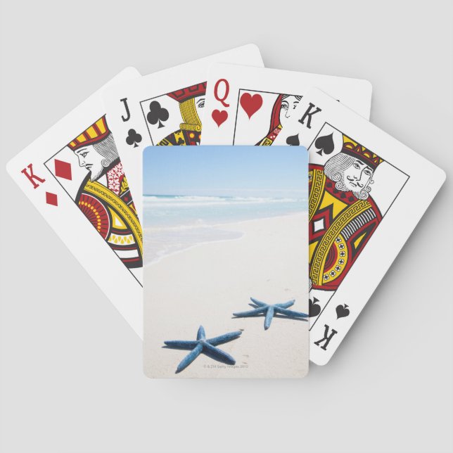 Two blue starfish at water's edge on tropical poker cards (Back)