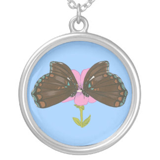 Two brown butterflies on a pink flower necklace