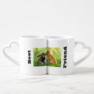 Two bunny rabbits kissing. coffee mug set