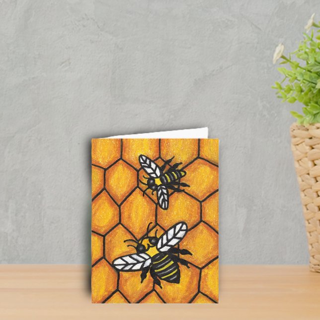 Two Buzzing Black Yellow Bumble Bees on Honeycomb Card (Two buzzing black and yellow bumble bees on golden honeycomb notecard.)