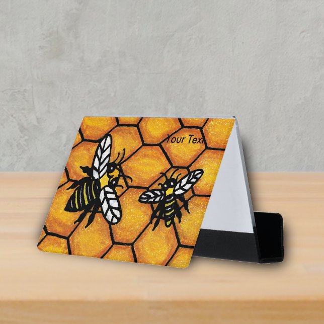 Two Buzzing Yellow Jacket Bees on Honeycomb Desk Business Card Holder (Two black and yellow buzzing bees on golden honeycomb business card holder.)