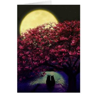 Two cats admiring the moonlight
