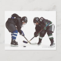 two caucasian hockey players wearing opposing