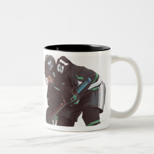two caucasian hockey players wearing opposing Two_Tone coffee mug