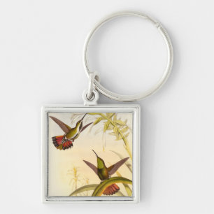 Two Colorful Hummingbirds Aiming for Same Flower Keychain