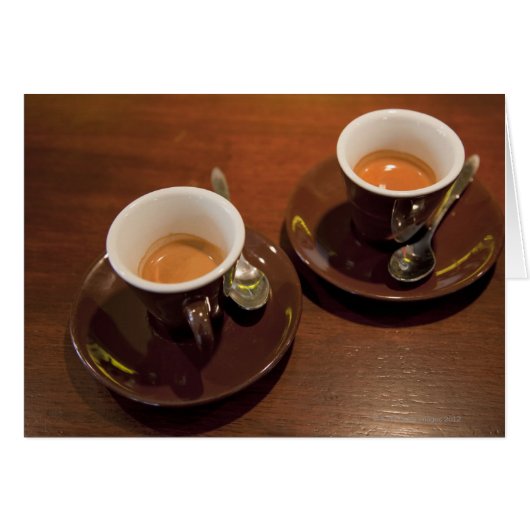 two cups of freshly brewed espresso coffee on a cards (Front Horizontal)